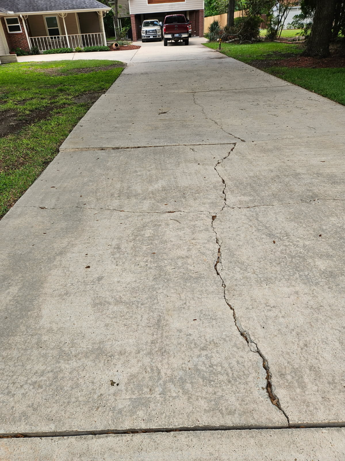 Before photo of major driveway trip hazard before concrete leveling in Cypress Texas