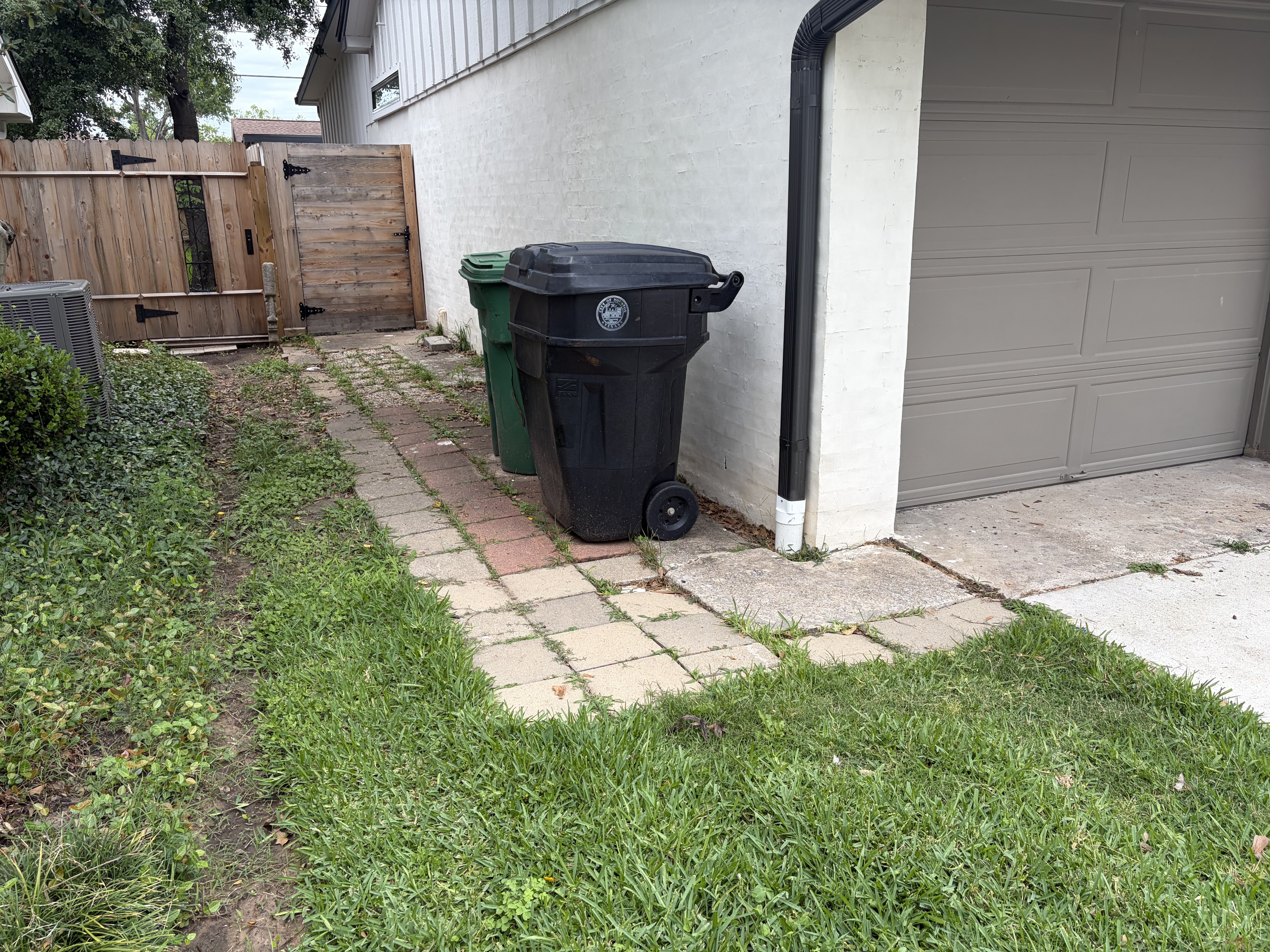 Before photo of old sidewalk area before concrete replacement in Houston Heights