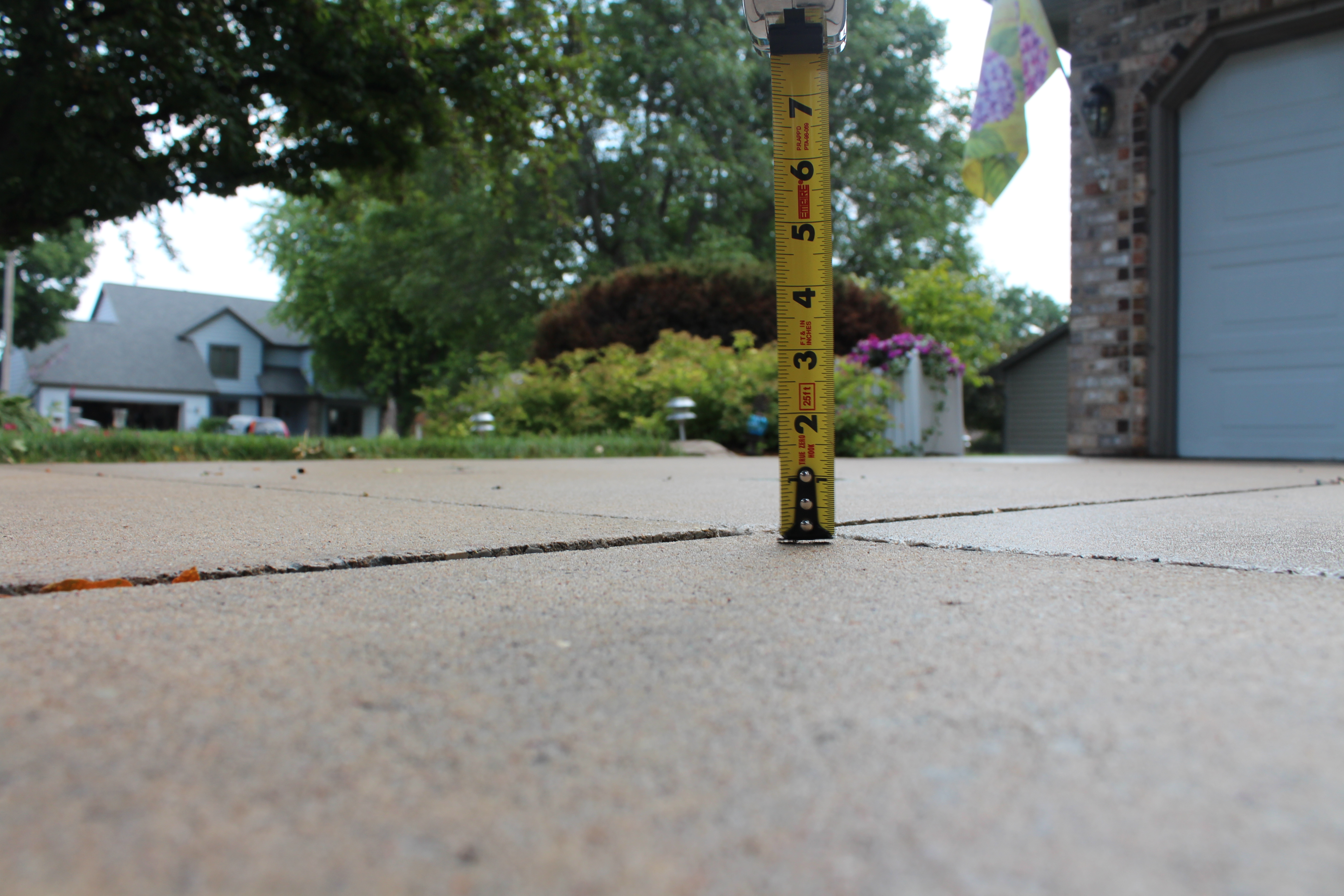 restored level concrete patio after polyurethane foam injection Houston TX