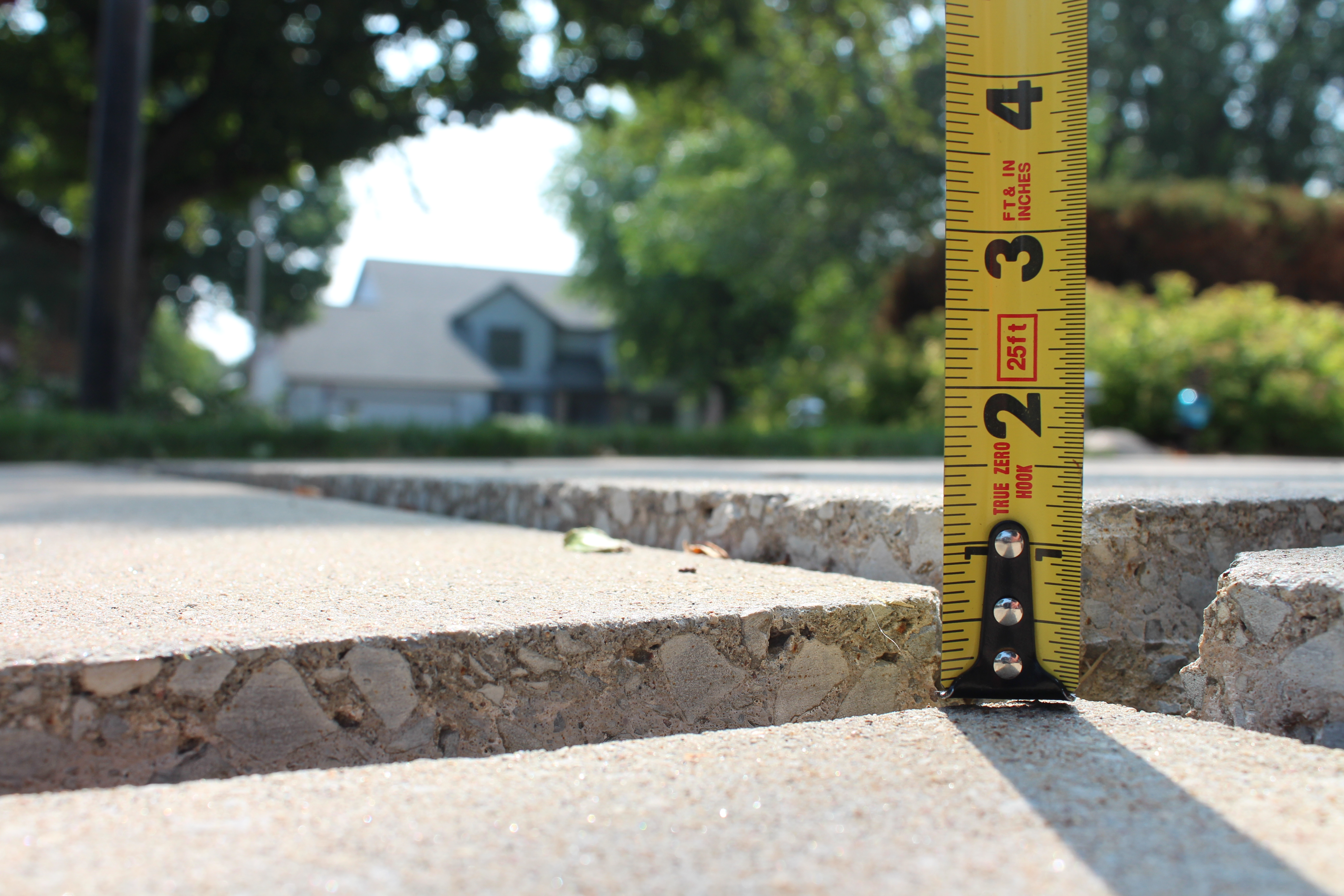 sunken uneven concrete patio before leveling repair Houston TX