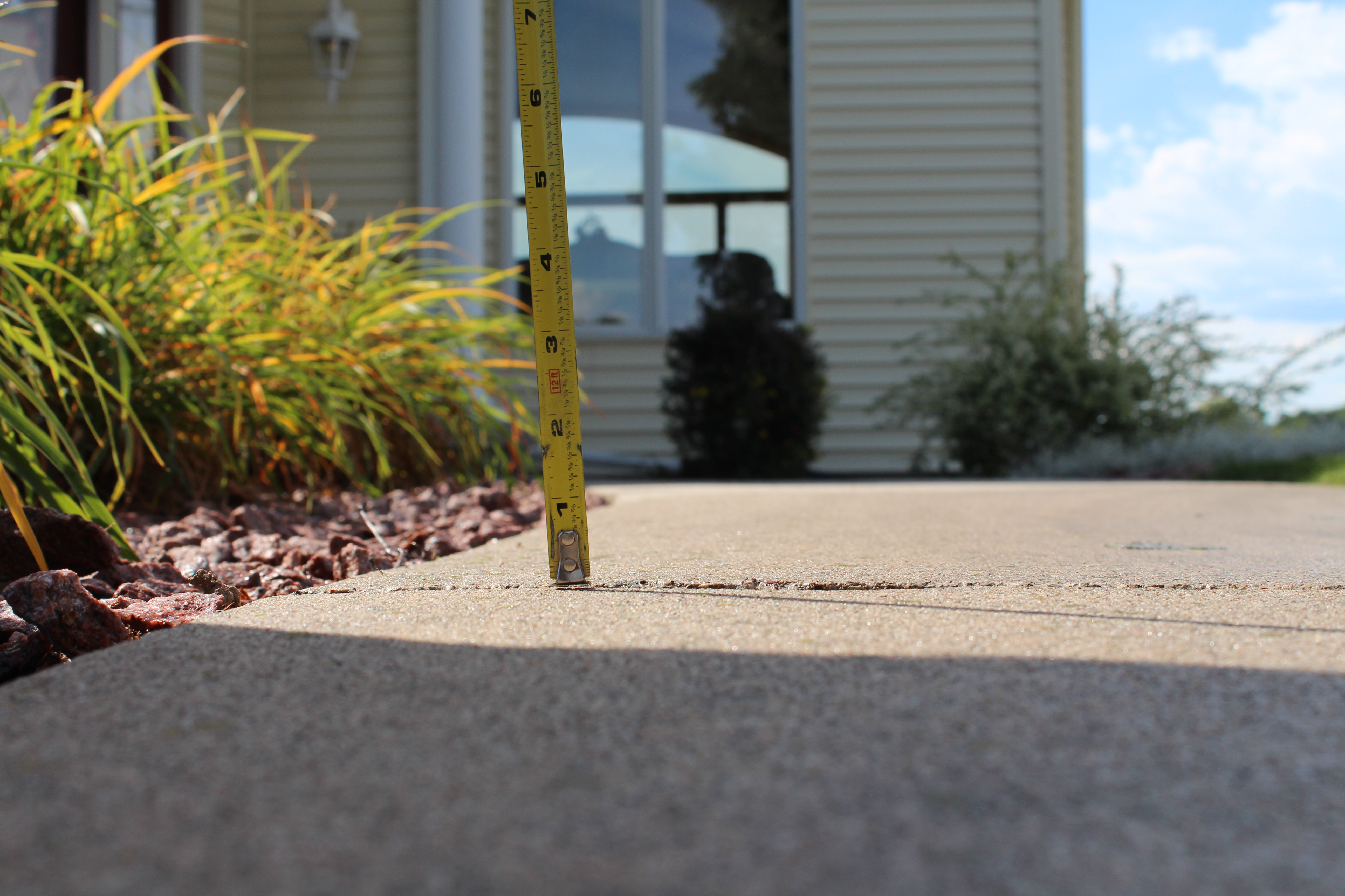 smooth level concrete walkway after polyurethane foam lifting repair Houston TX